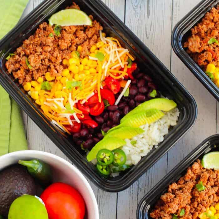 a black lunch box of burrito bowl meal