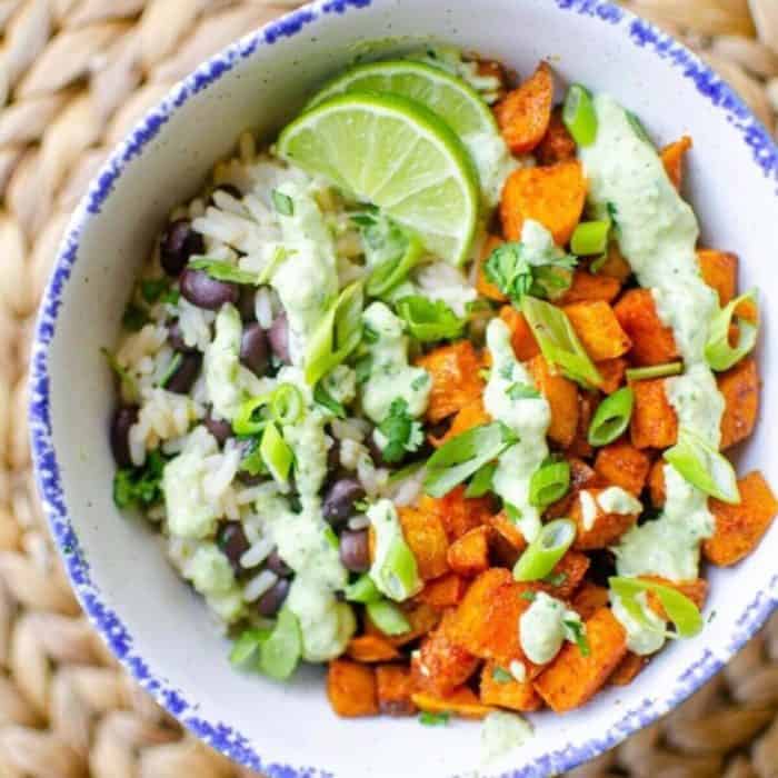 a photo of a white bowl filled with sweet potato black bean bowl