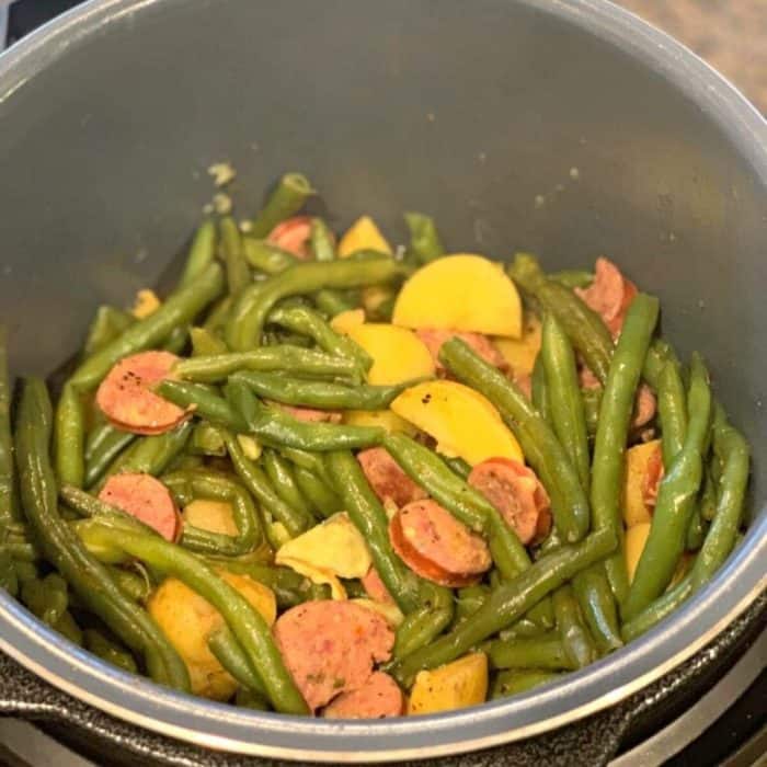 a photo of instant pot sausage green beans potatoes on a casserole