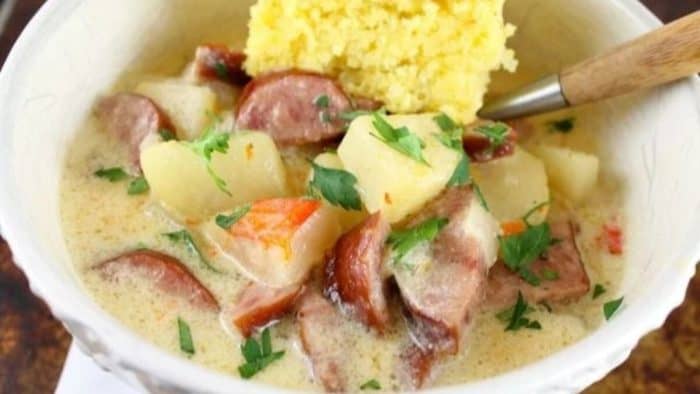 a photo of Slow Cooker Cheesy Smoked Sausage and Idaho Potato Soup in a bowl