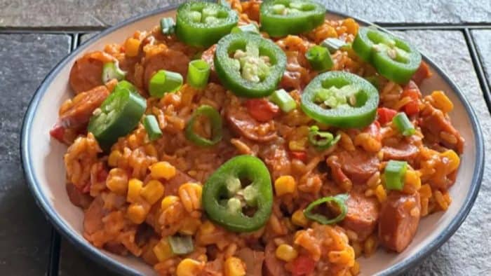 a photo of cheesy smoked sausage rice salsa in a plate 