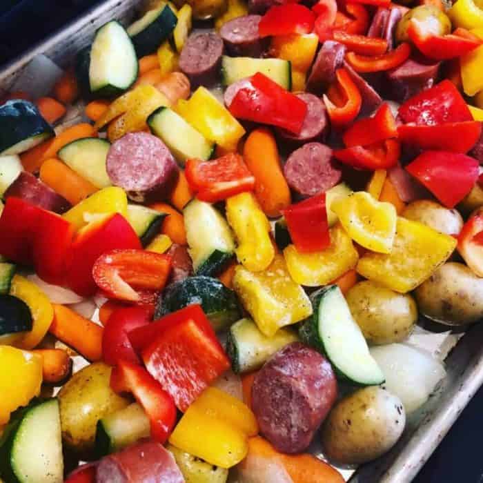 a photo of kielbasa veggie sheet pan 