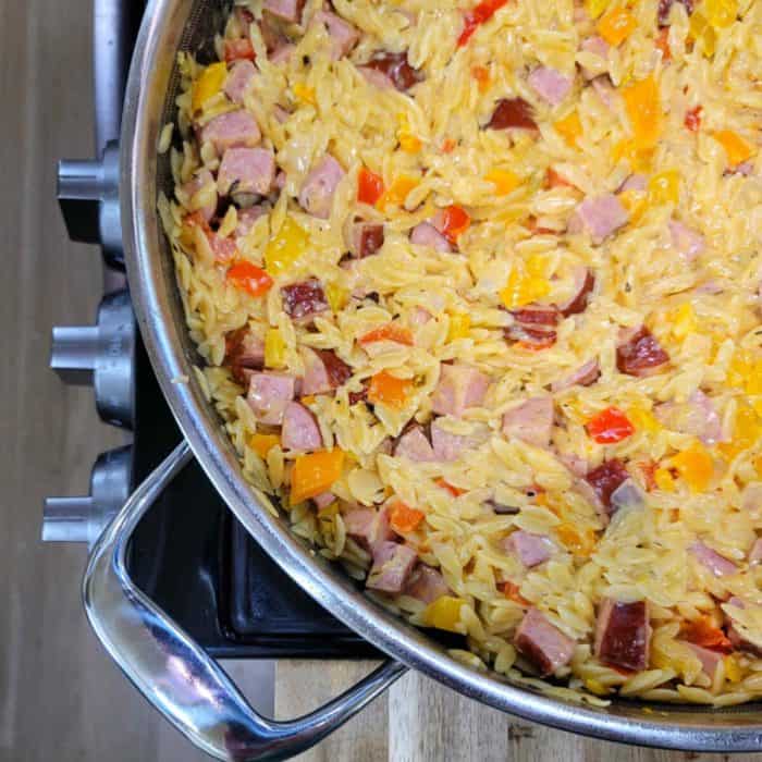 a photo of one pot sausage peppers pasta on casserole
