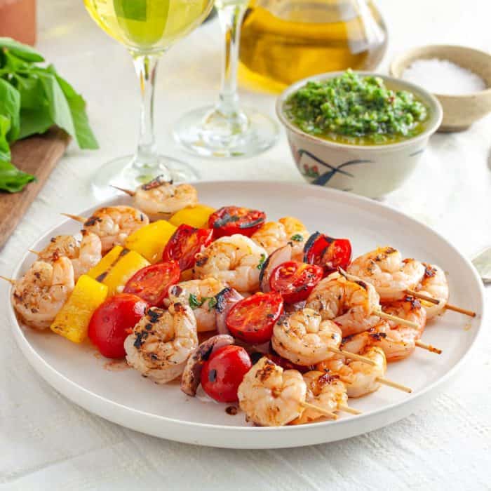 Remove skewers from the grill and arrange on a serving platter. Serve with the zhoug sauce.