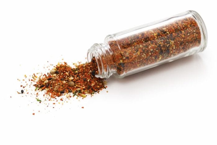 Shichimi Togarashi (aromatic spices that are indispensable for Japanese cuisine) spilled from the bottle.A mixture of dried chili pepper and other seasonings