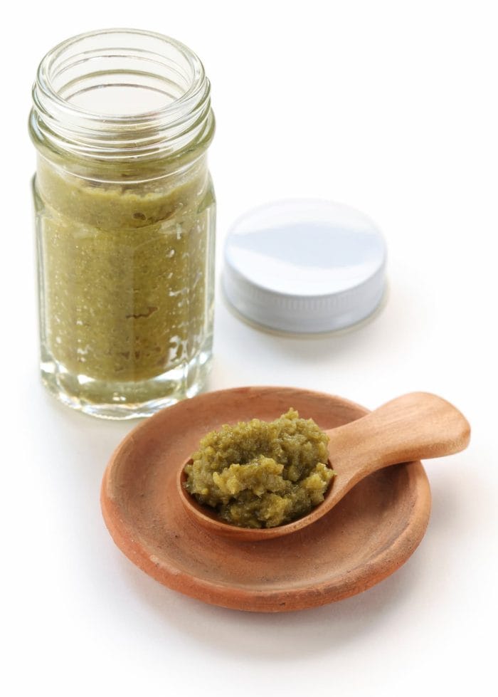 a bottle of yuzukosho, japanese condiment, yuzukosho is a fermented condiment that made from grated yuzu rind, chili peppers and salt.