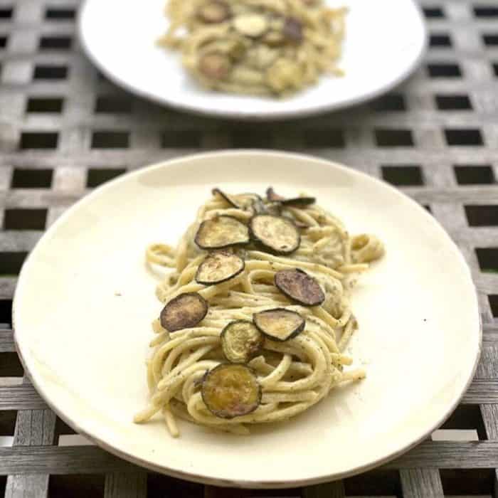 a plate of Vegan Spaghetti Alla Nerano on a checkered table