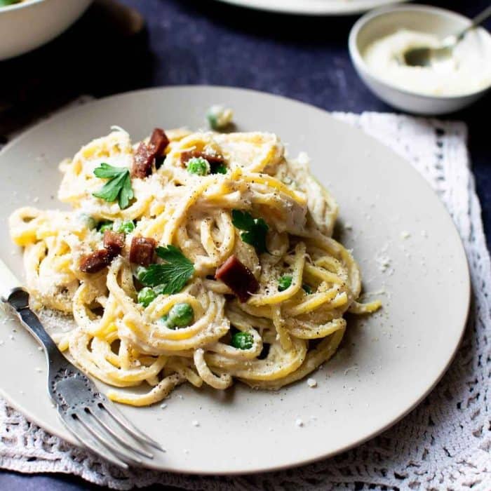a plate of Vegan Carbonara with a fork on the side