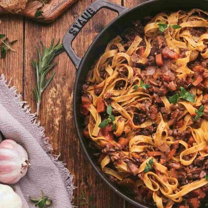Mushroom Ragu vegan pasta recipe on a pan placed on a wooden surface