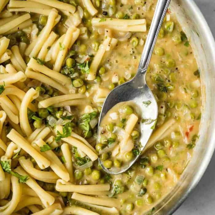 a close up photo of White Wine Pasta Sauce with a spoon on it