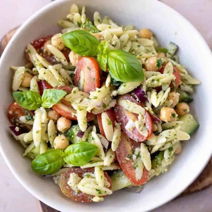 Tender yet firm, the orzo here pairs beautifully with salad classics like onions, cucumbers, tomatoes, and chickpeas.