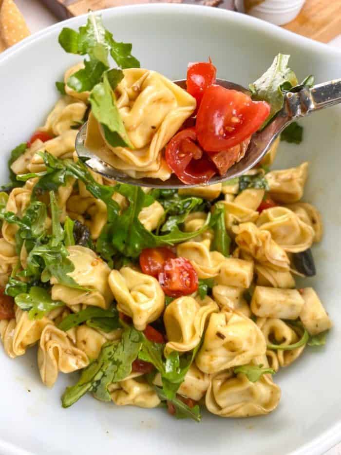 Introducing the tortellini antipasto salad, a scrumptious medley that's sure to tantalize your taste buds. Imagine tender tortellini mingling with the spicy kick of pepper jack cheese, all dressed in a tangy balsamic vinaigrette. 