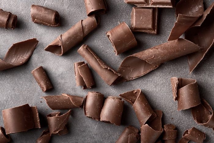 Chocolate curls on grey background