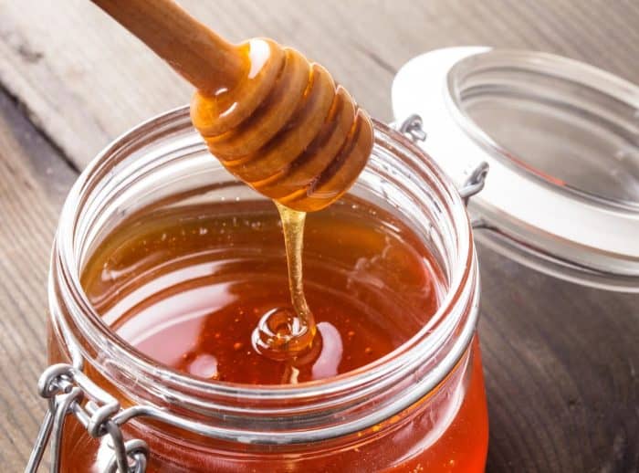 honey drip placed on a mason jar