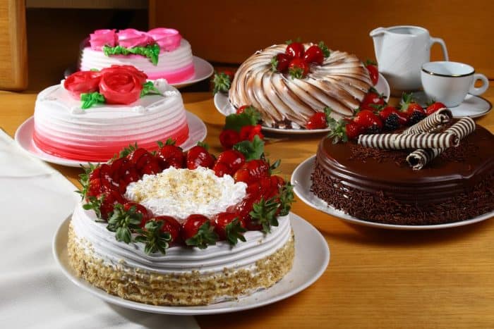 Brazilian cake dessert different flavors on a wooden table