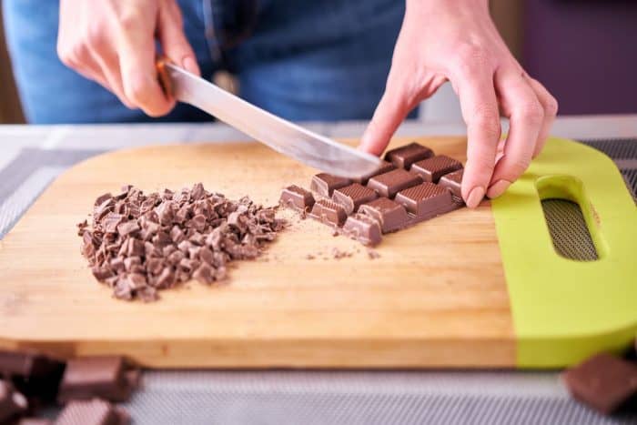 In a medium heavy-bottom saucepan, combine the roughly chopped milk chocolate and dark chocolate with the sweetened condensed milk.