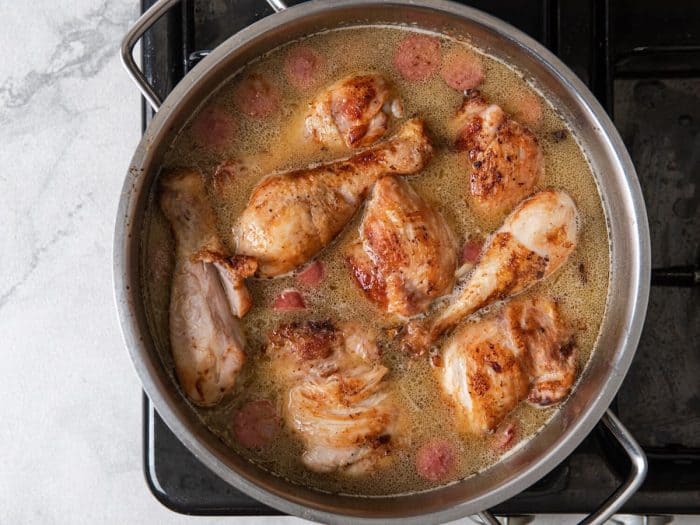 Nestle the pre-cooked chicken pieces into the broth.