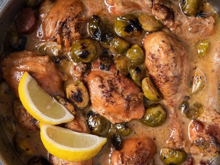 This dish takes the traditional coq au vin to new heights by infusing it with the crispiness of dry white wine and the smoky richness of sausage, all perfectly complemented by the earthy tones of Brussels sprouts. 