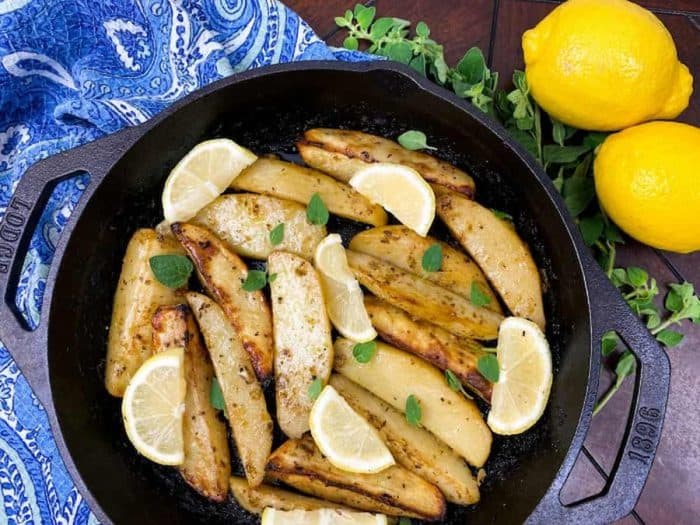 perfectly crispy potato wedge, subtly infused with the zest of fresh lemon and the warmth of a myriad of Mediterranean spices with real lemon on the sides