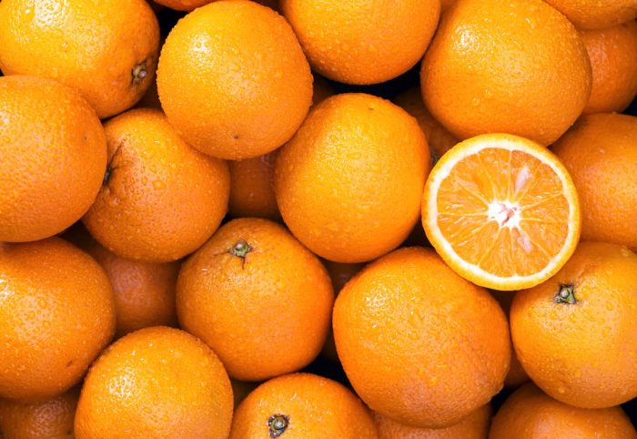 a bunch of fresh orange background close up