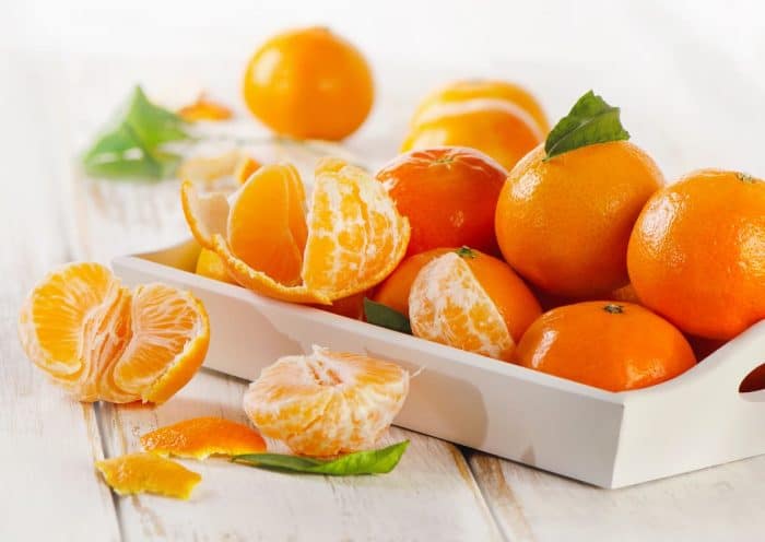 Ripe tangerines with leaves