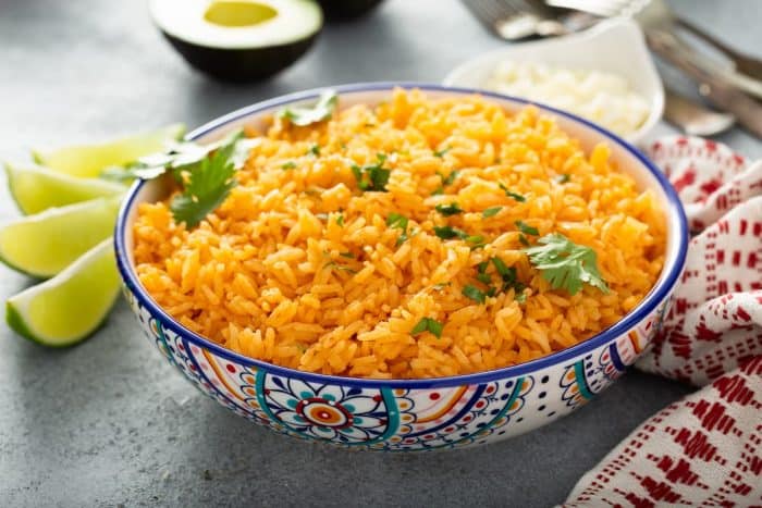 a bowl of freshly cooked mexican rice placed on the dining area