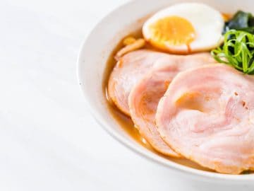 Chashu typically refers to the succulent slices of pork belly that have been simmered until tender. 