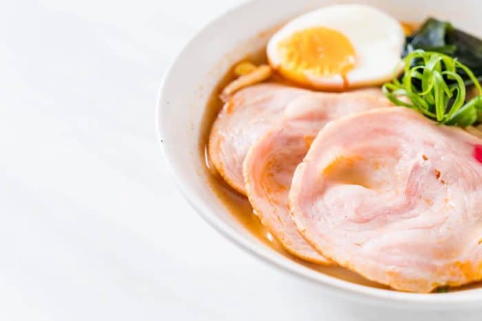 Chashu typically refers to the succulent slices of pork belly that have been simmered until tender.