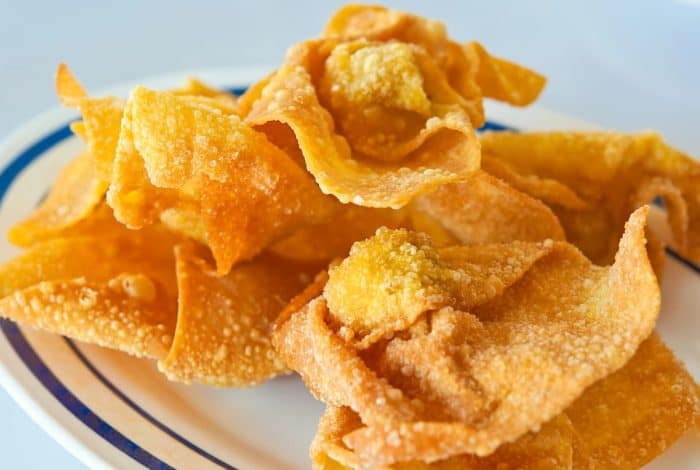 Thin fried wonton strips offer a crisp texture that's both light and satisfying, complementing the smoothness of the noodles with a contrasting crunch.