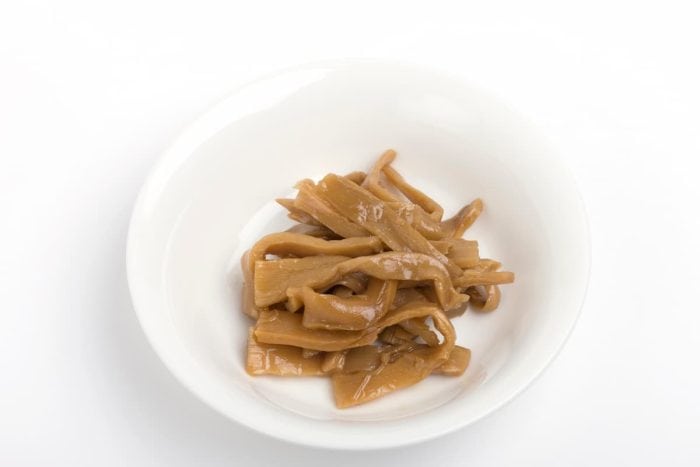 Menma. bamboo shoots boiled, sliced, fermented, dried or preserved in salt, then soaked in hot water and sea salt.