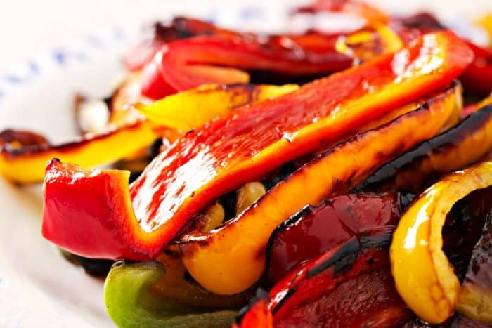 For a sweet, smoky twist, top your ramen with roasted red bell peppers. They bring a colorful appeal and a soft, chewy texture that contrasts with the traditional crisp toppings like bamboo shoots or bean sprouts.