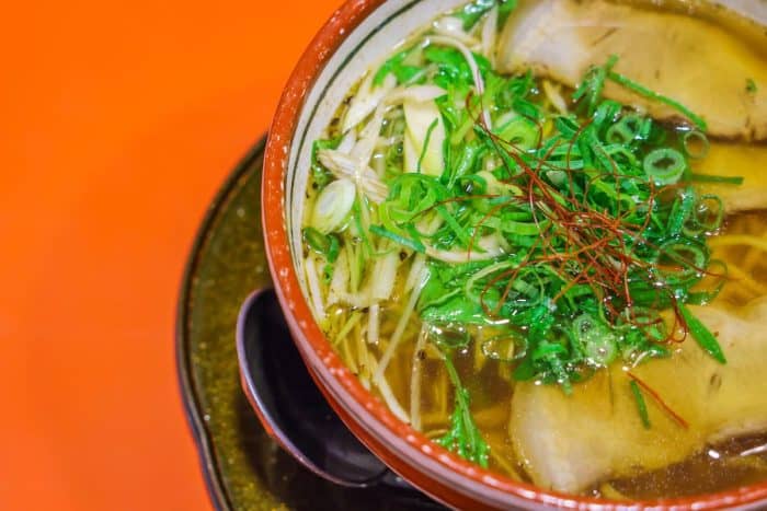 Finely chopped scallions, or negi, contribute a fresh, sharp bite. They cut through the richness of the broth and balance the heavier flavors with their crispness.