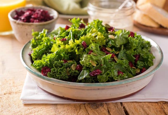 a bowl of shredded kale on the kitchen table