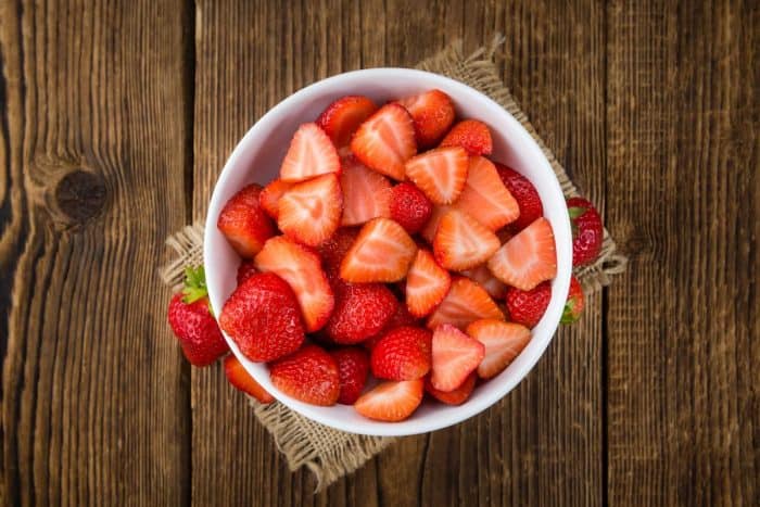 Strawberries on rustic wooden background