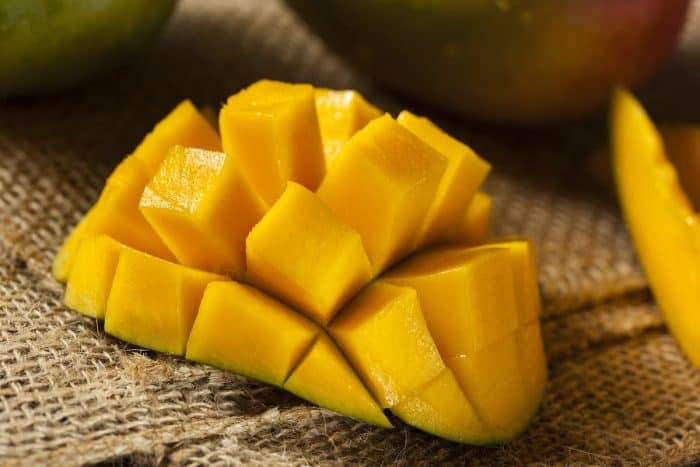 Organic Colorful Ripe Mangos on a kitchen table