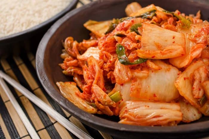 a close up image of a small bowl full of kimchi