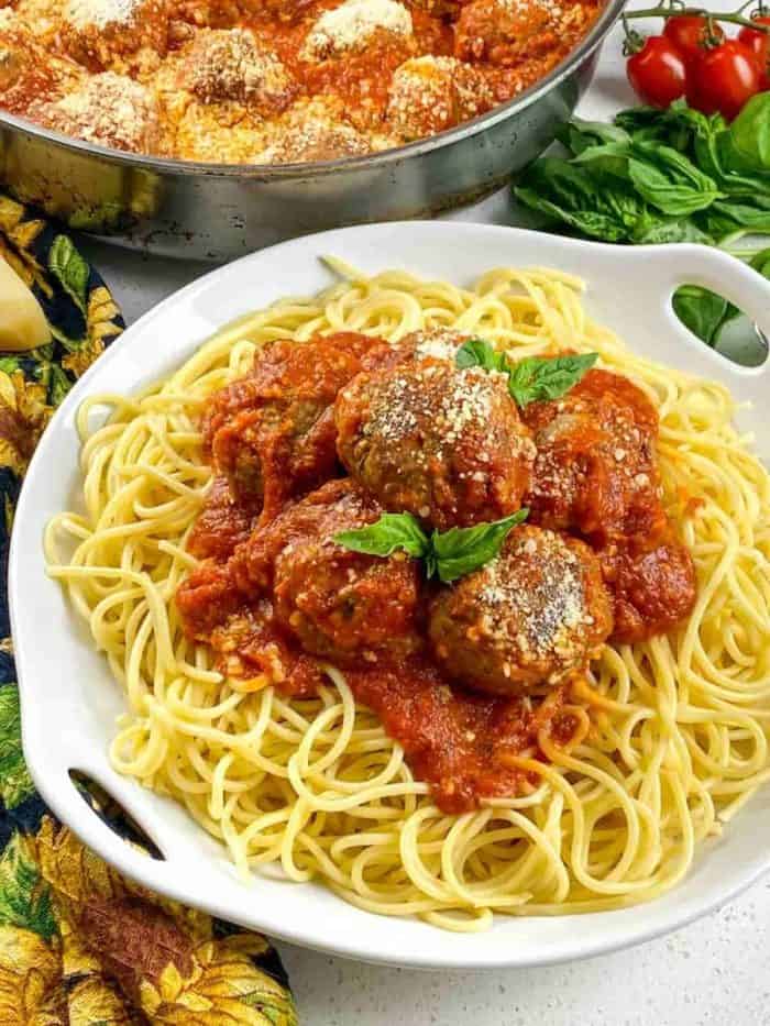 this spaghetti and meatballs recipe — a classic comfort dish that's been elevated with fresh herbs and a blend of beef and pork for the ultimate flavor.