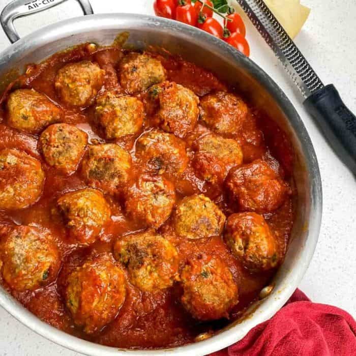 Pour the marinara into a skillet over medium-low heat. One by one, carefully add the baked meatballs to the sauce. Turn the meatballs while cooking to fully coat them in marinara sauce.