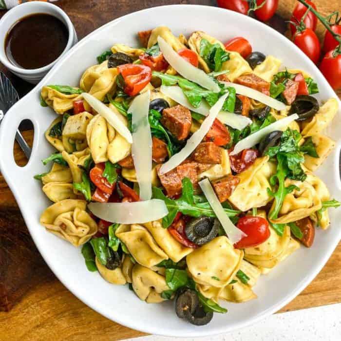 Introducing the tortellini antipasto salad, a scrumptious medley that's sure to tantalize your taste buds. Imagine tender tortellini mingling with the spicy kick of pepper jack cheese, all dressed in a tangy balsamic vinaigrette. 