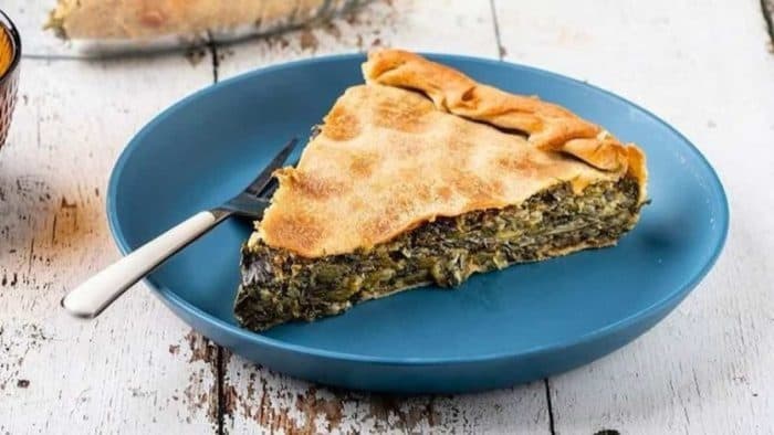 Rich with the flavors of seasonal greens and herbs, hortopita is a traditional Greek greens pie that’s encased in a flaky golden crust.