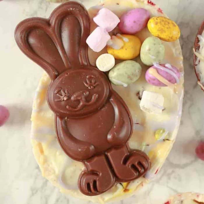 This no-bake dessert is the epitome of Easter cheer, featuring a creamy filling and a vibrant array of vegan Easter eggs as a topping.