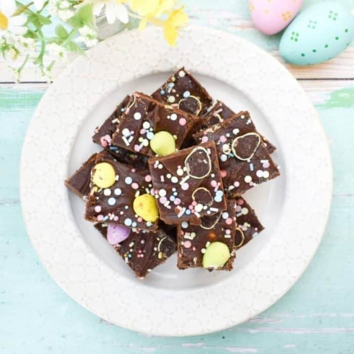 Indulge your sweet tooth with this Easter vegan mini egg fudge, a creamy and colorful confection dotted with adorable pastel mini eggs.