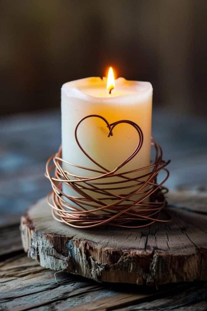 Crafting beginners and experts alike can easily make this DIY candle holder, where wire wraps around the candles and showcases a charming heart design at the ends. 