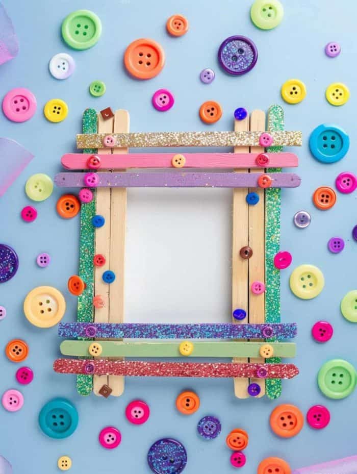 Decorated with a child's choice of buttons, glitter, and paint, these popsicle stick frames offer a charming border for their favorite family photo.