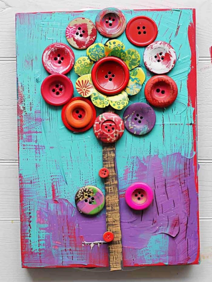 Glued onto a canvas, buttons come together to form a tactile flower bouquet on wires that you can easily put up on the walls.