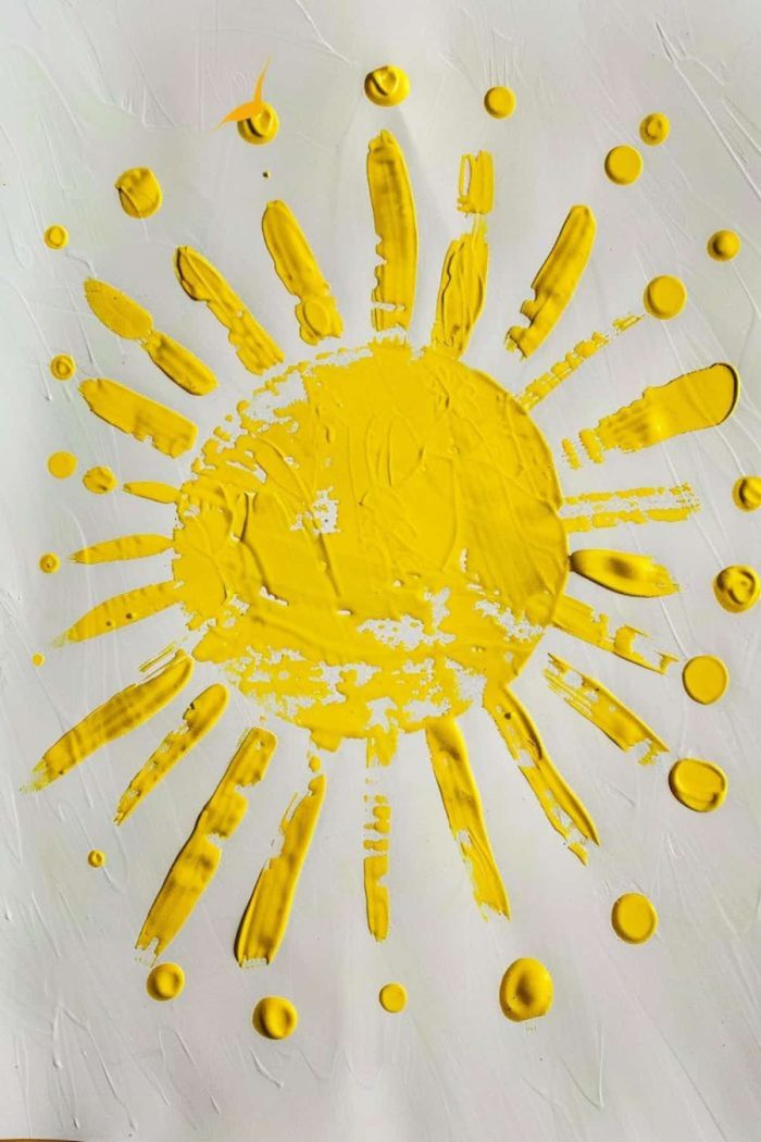 Tiny fingers create handpainted yellow sunshine rays in this Mother’s Day craft idea, giving beloved moms a bright and beautiful keepsake.