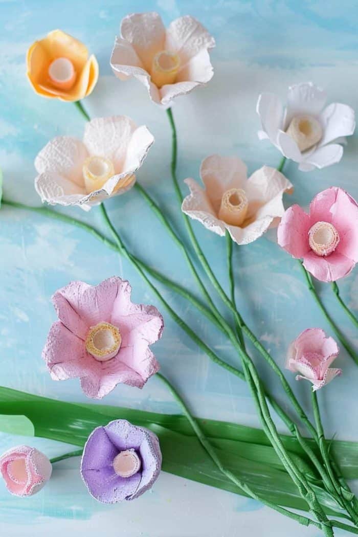Sculpting delicate egg carton flowers and dyeing them in soft hues helps kids learn about upcycling in a fun way and transform kitchen waste into a treasured keepsake.