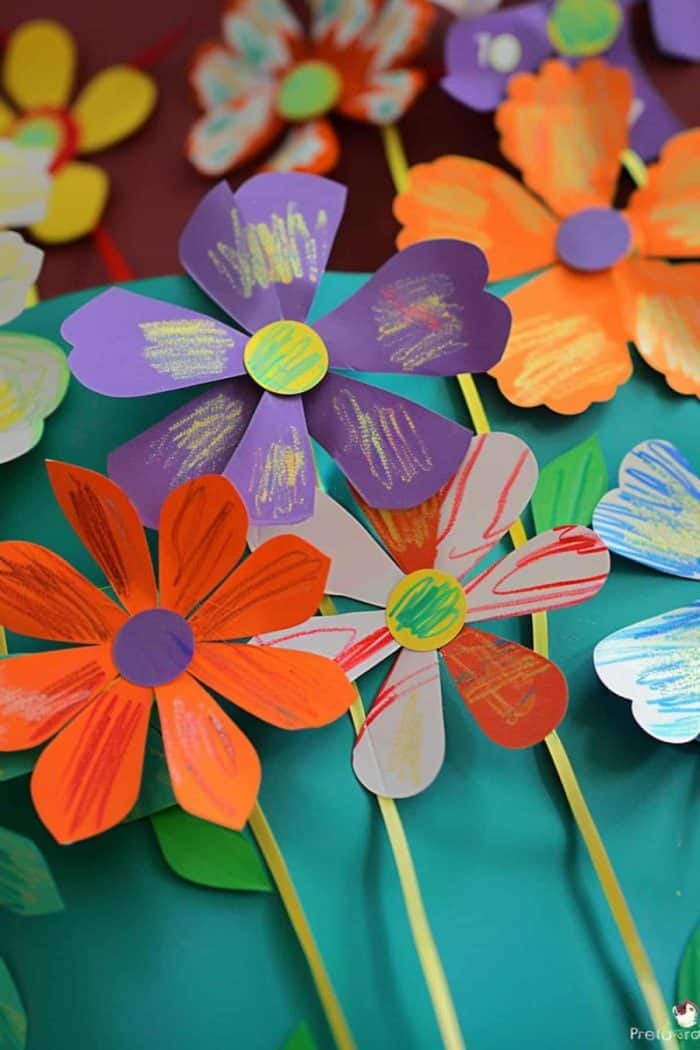 These construction paper flowers blossom with crayon accents and create a garden that showcases young ones’ artistic talents.