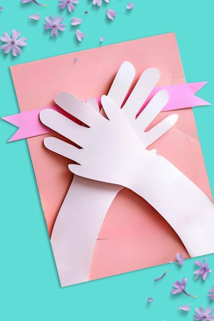 Cutouts of long paper arms — ready to wrap around Mom — convey a comforting and playful embrace from her little one.
