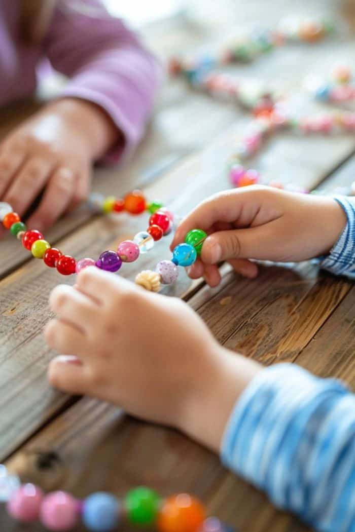 Simple beads strung by eager young hands craft a message of love in a necklace. Perfect for a Mother's Day surprise!